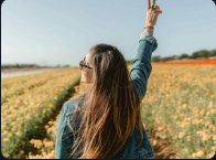 Woman standing in a flower field