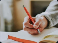 Person writing in a notebook
